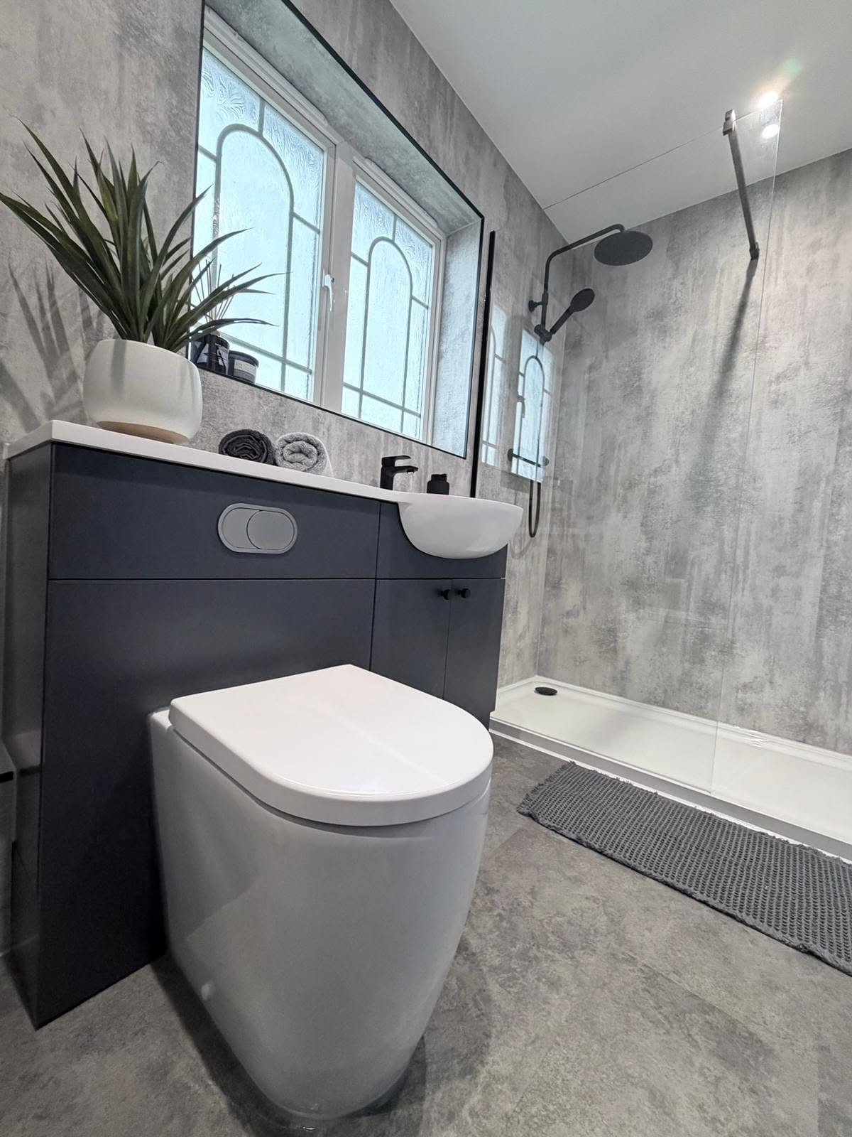 Streamlined contemporary bathroom layout with modern sanitaryware and clean sightlines