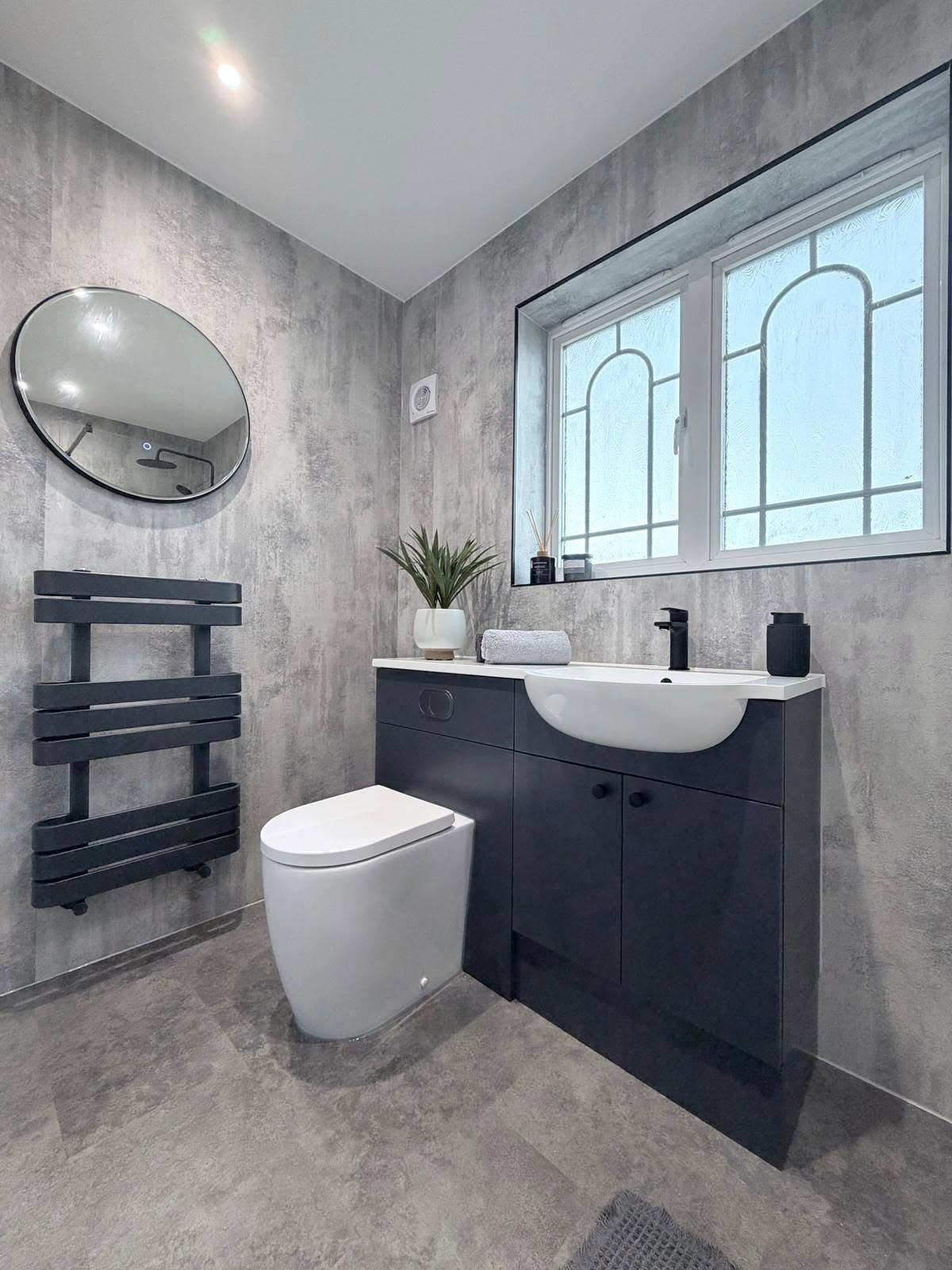 Modern bathroom with wall-mounted furniture and concealed contemporary fittings