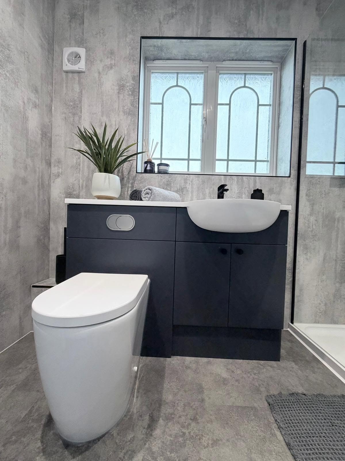 Modern bathroom lighting and mirror arrangement with contemporary layered illumination