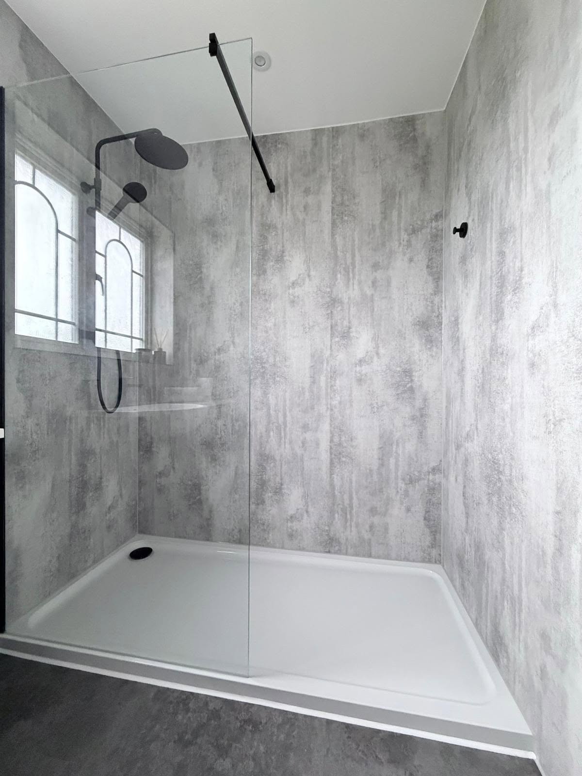 Contemporary bathroom material palette with coordinated tiles, metals and neutral finishes