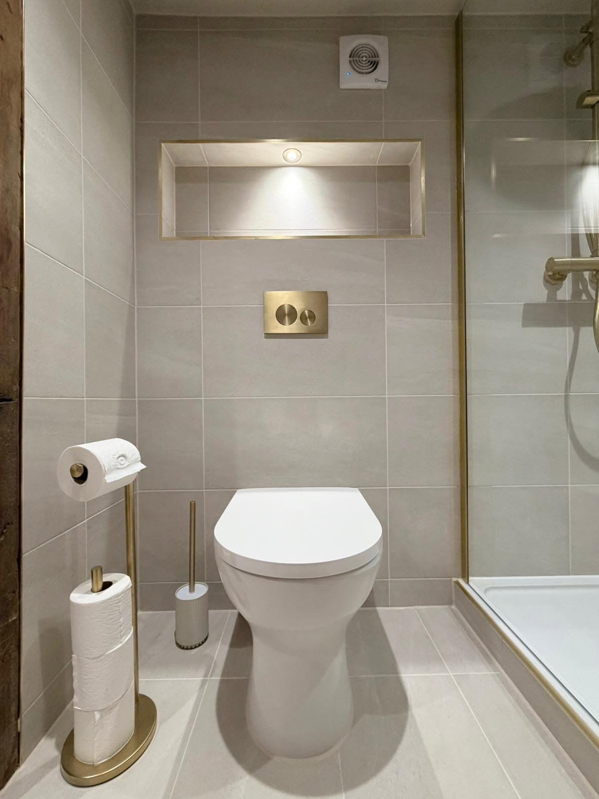 Bespoke rustic bathroom renovation in Derbyshire with brass fittings and shower screen