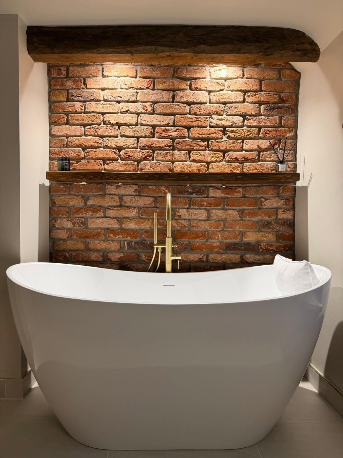 Bathroom feature wall and freestanding bath as part of a full bathroom remodel in Derbyshire