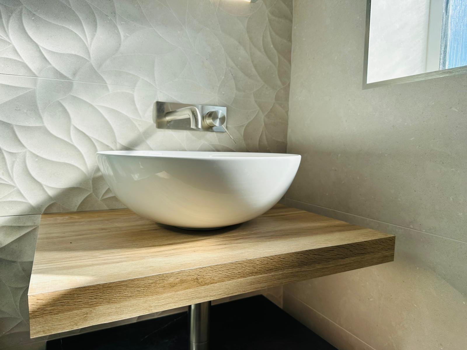 Biophilic bathroom refurbishment in Derbyshire with natural green tones and organic textures
