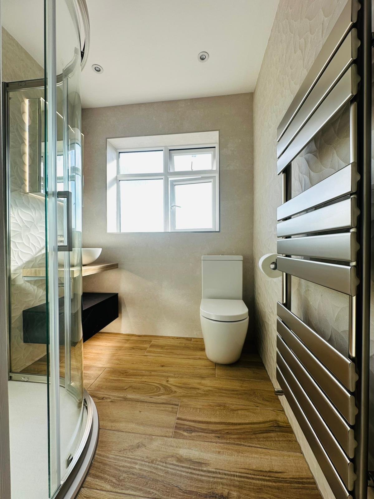 Textured organic bathroom surfaces designed for tactile contrast in Derbyshire