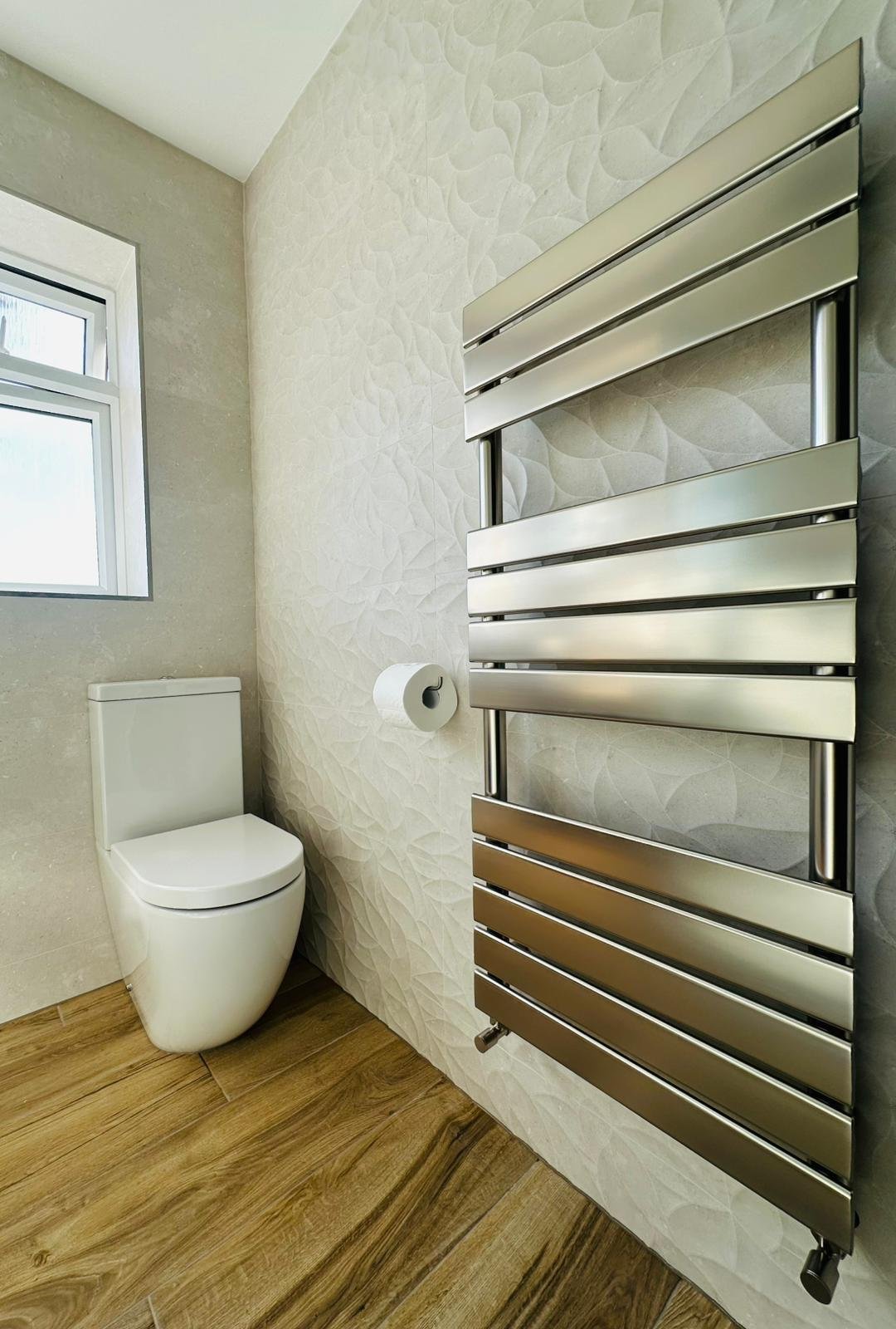Bathroom using natural daylight and privacy-conscious window treatment in Derbyshire